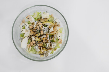 homemade healthy fresh salad with blue cheese, pears, nuts and balsamic dressing, vegetable salat