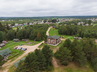 Fototapeta na wymiar August, 2020 - Morshchinskaya. View of the Russian village and the visit-center of the Kenozersky National Park. Russia, Arkhangelsk region