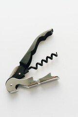 Metal corkscrew on white background, open wine bottle equipment, drinks concept, wine cork opener