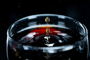 A Drop in a glass of drink soda