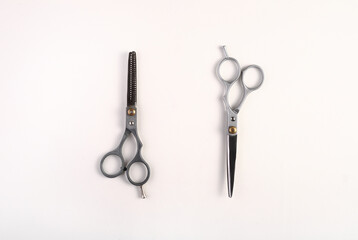 Scissors for cutting and thinning on a white background.