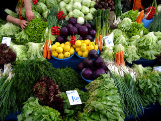 A vegetable and fruit stall in a farmers market in Istanbul, Turkey.  It's written 