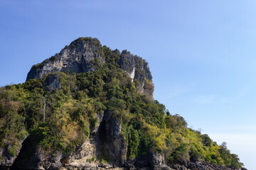 Fototapeta na wymiar green-lined mountain against blue sky, Thailand, Krabi