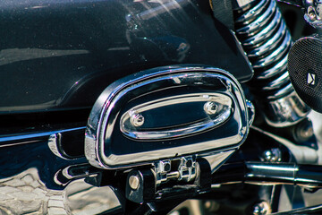 Closeup of a motorcycle parked in the streets of the city center of the metropolitan area
