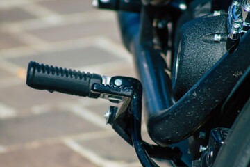 Closeup of a motorcycle parked in the streets of the city center of the metropolitan area
