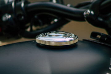 Closeup of a motorcycle parked in the streets of the city center of the metropolitan area
