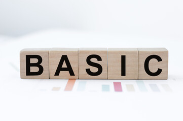 Innovation word wood block BASIC on table for business concept.