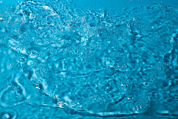 splash of water on a blue background. Abstract wallpaper