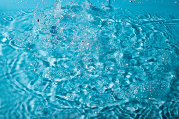 splash of water on a blue background. Abstract wallpaper