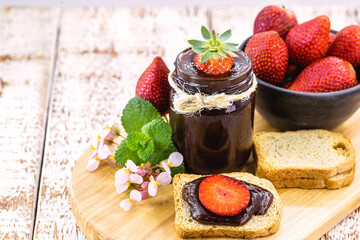 toast with organic fruit jam, on a rustic white wooden table. Brazilian fruit and home made sweet