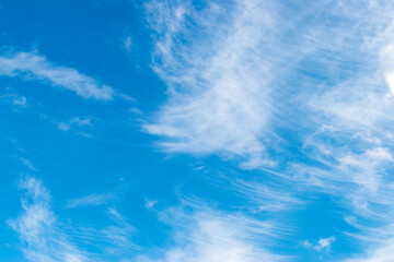 white clouds in the blue sky. Background