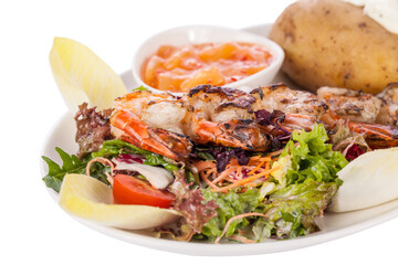Grilled prawns with endive salad and jacket potato