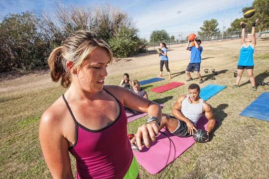 Fitness Trainer Checking Time