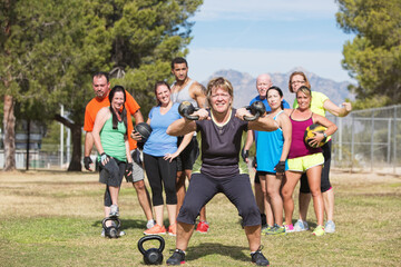 Happy Woman Lifting Weights