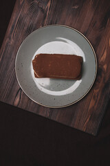 Two almond biscuits on a stone slab. Tasty food