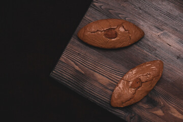 Delicious almond cookies on a wooden background. Tasty food