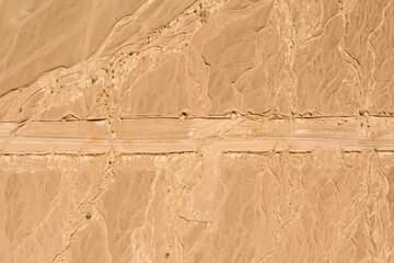 Desert path, high altitude aerial image.

