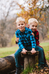 Portrait of blonde twin brothers in hugs