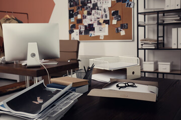 Crime scene photos and documents on table. Detective agency