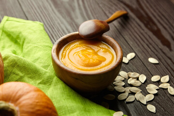 Autumn pumpkin cream soup with pumpkin seeds