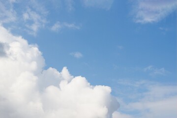 Beautiful white fluffy clouds on a blue sky background