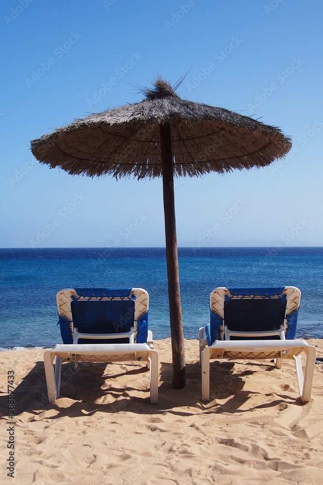 Poster beach chairs on perfect sand beach