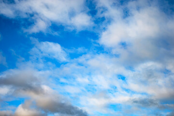 Blue sky background with a tiny clouds