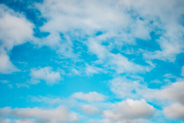 Blue sky background with a tiny clouds
