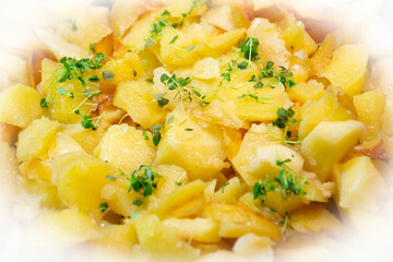 Potato gratin or potato kugel. A bake with cheese, basil and potatoes close up view textured surface.