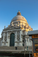 Fototapeta premium The setting afternoon casts Basilica di Santa Maria della Salute into half shadow 