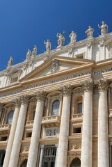 Fototapeta na wymiar Vertical detail of entrance Facade of St Peters Basilica in Rome