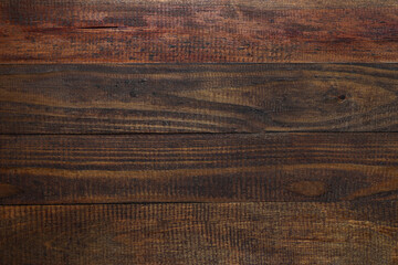 Old wooden dark brown background with scuffs and cracks. Horizontal painted boards.Texture for design