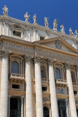 Fototapeta na wymiar Vertical detail of Facade of St Peters Basilica in Rome