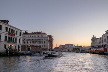 Fototapeta premium Heading up the the Grand Canal towards Ponte dell'Accademia with the sun setting in the distance 