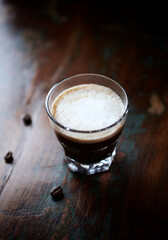 Coffee with milk on dark wooden background. Close up.	