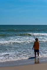 Man on Beach Surf Fishu=ing