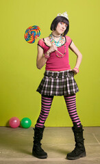 Young punk woman with a big lollipop © Yay Images