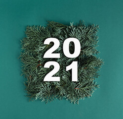 2021 made with green thuja branches. Minimal new year concept. Flat lay.