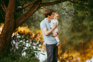 happy family father and son walking in nature