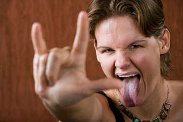Pretty Woman Making Bull Horns