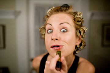 Woman Applying Lipstick