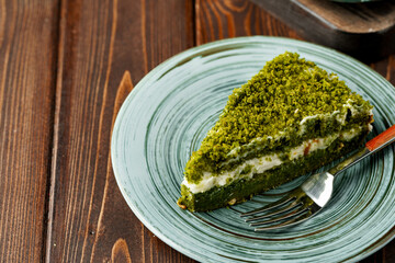 Piece of green spinach cake on plate