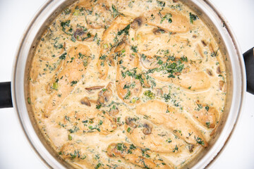 Creamy Herb Mushroom Chicken with steamed rice, dill and parsley in the pan shot from above
