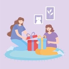 smiling young women opening gift box on carpet