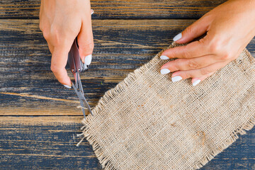 Dining table care concept on white background flat lay. female shaping piece of sack.