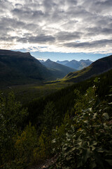 Cloudy Sun Lit View into Logan Creek Valley form the Going to the Sun road in Glacier National Park