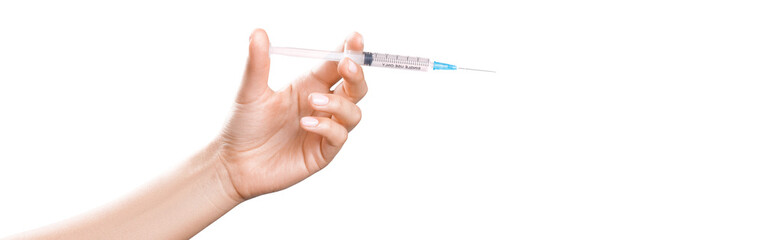 Hand holding syringe with vaccine against corona virus.