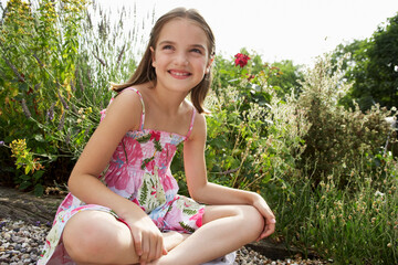 Girl Sitting in Meadow