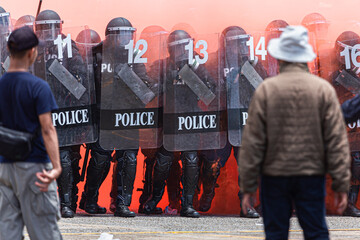 The fight between citizens and the police in the insurgency,uprising,People causing rioting against...