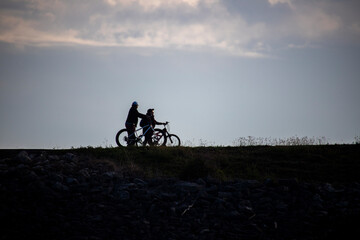 Couple walking Bicycles